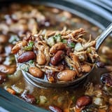Slow-cooked 15-bean soup with smoked turkey and vegetables, perfect for warming up on cold days.  