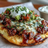 Savory cloud bread tacos featuring seasoned taco meat and fresh, bright pico de gallo.