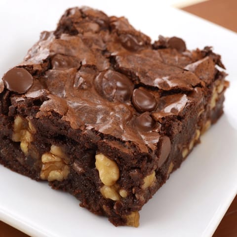 Warm, gooey brownies fresh from the oven, ready to be cut into perfect squares for dessert time.
