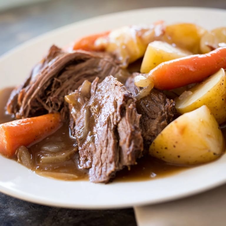 A close-up of a flavorful beef pot roast with slow-cooked vegetables, perfect for a cozy supper.
