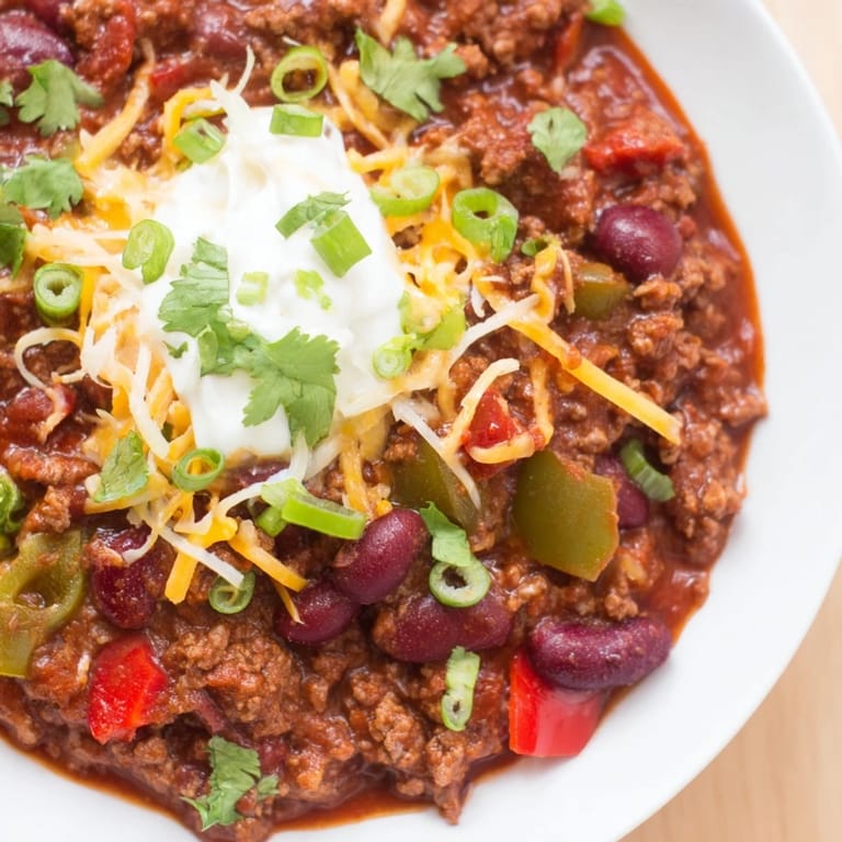 Ground beef and beans simmer in this flavorful Chili con Carne, ready with added spices.