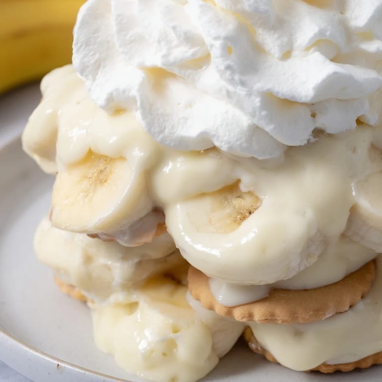 A layered Southern banana pudding dessert: a taste of vanilla pudding, bananas, and whipped cream.