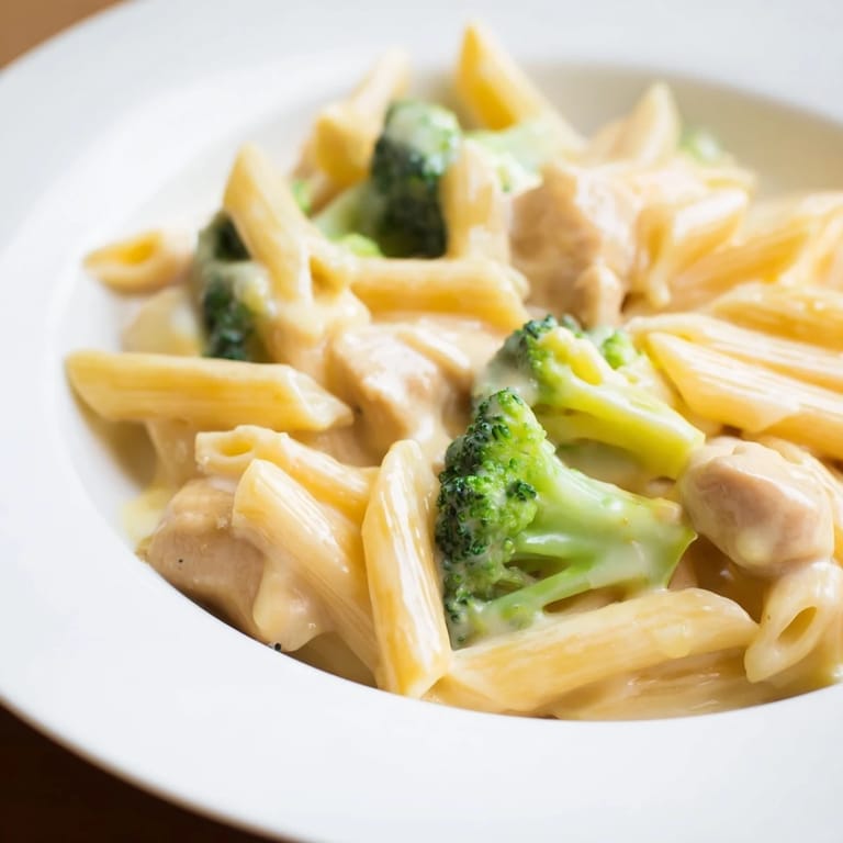 Golden-brown chicken and bright green broccoli tossed with penne in a rich, homemade cheddar cheese sauce.
