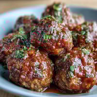 Slow cooker meatballs in rich tomato sauce, tender and juicy, perfect for easy entertaining or weeknight dinners.  